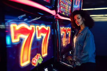 A cheerful woman in traditional clothing using her smartphone during a festive moment, showing how easily the OKTK app fits into everyday life.