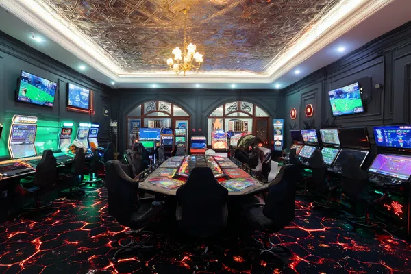 OKTK Casino — Step inside our high-end casino experience A glamorous woman holding casino chips in a neon-lit environment, representing the premium online casino atmosphere of OKTK.